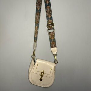 Stylish Cream Crossbody Bag with Patterned Strap
